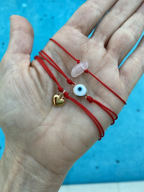 .Adjustable red cord charmed Bracelet